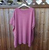 Rosa stickad poncho